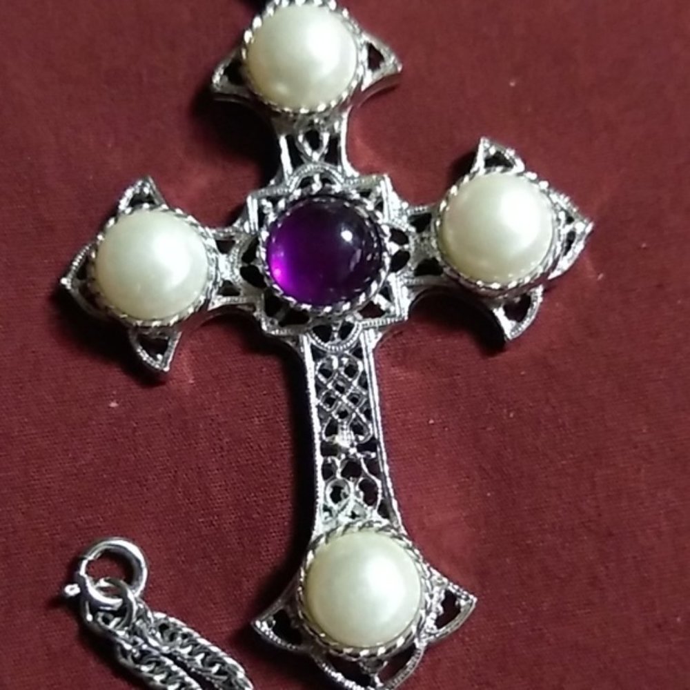 Pearl and purple stone crucifix.
